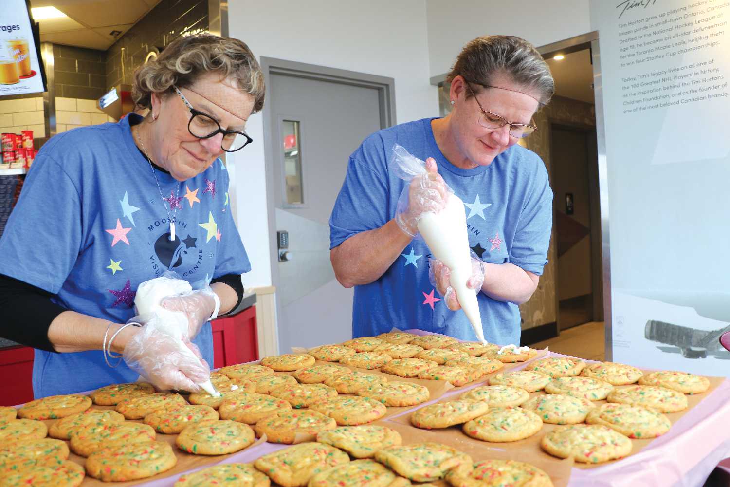 Lila Smart and Jen Grant with the Moosomin Visual Arts Centre making Holiday Smile Cookies last week. Proceeds from Smile Cookie sales will be going to the Moosomin Visual Arts Centre this year.